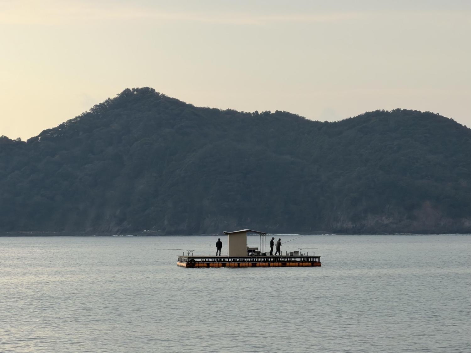 Men fishing in a tropical bay